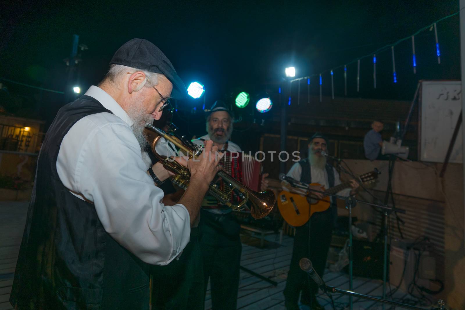 Safed, Israel - August 14, 2018: Scene of the Klezmer Festival, with street musicians playing, in Safed (Tzfat), Israel. Its the 31st annual traditional Jewish festival in the public streets of Safed