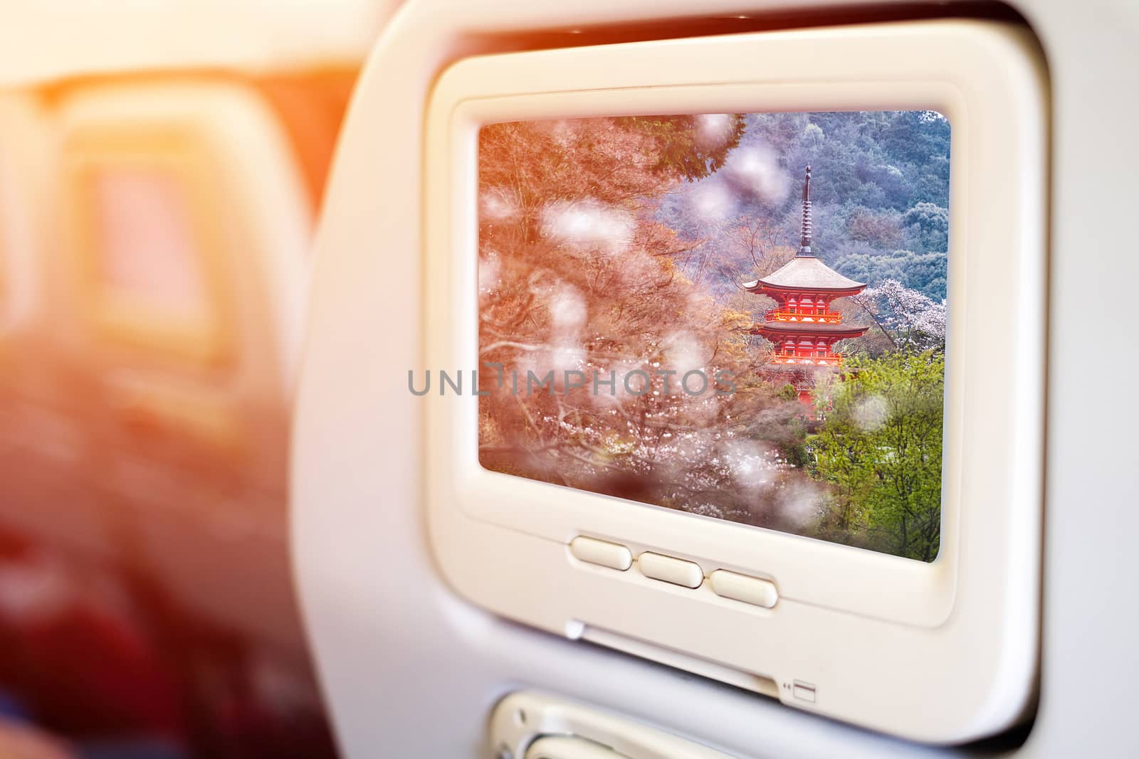 Aircraft monitor in front of passenger seat showing Aircraft mon by Surasak