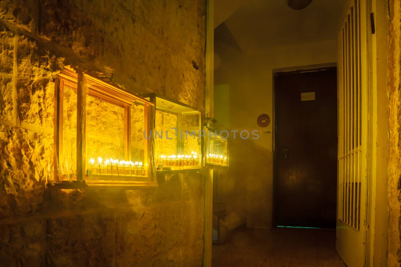 JERUSALEM, ISRAEL - DECEMBER 29, 2016: House entrance with a display of Traditional Menorahs (Hanukkah Lamps) with olive oil candles, in the Jewish quarter, Jerusalem Old City, Israel.