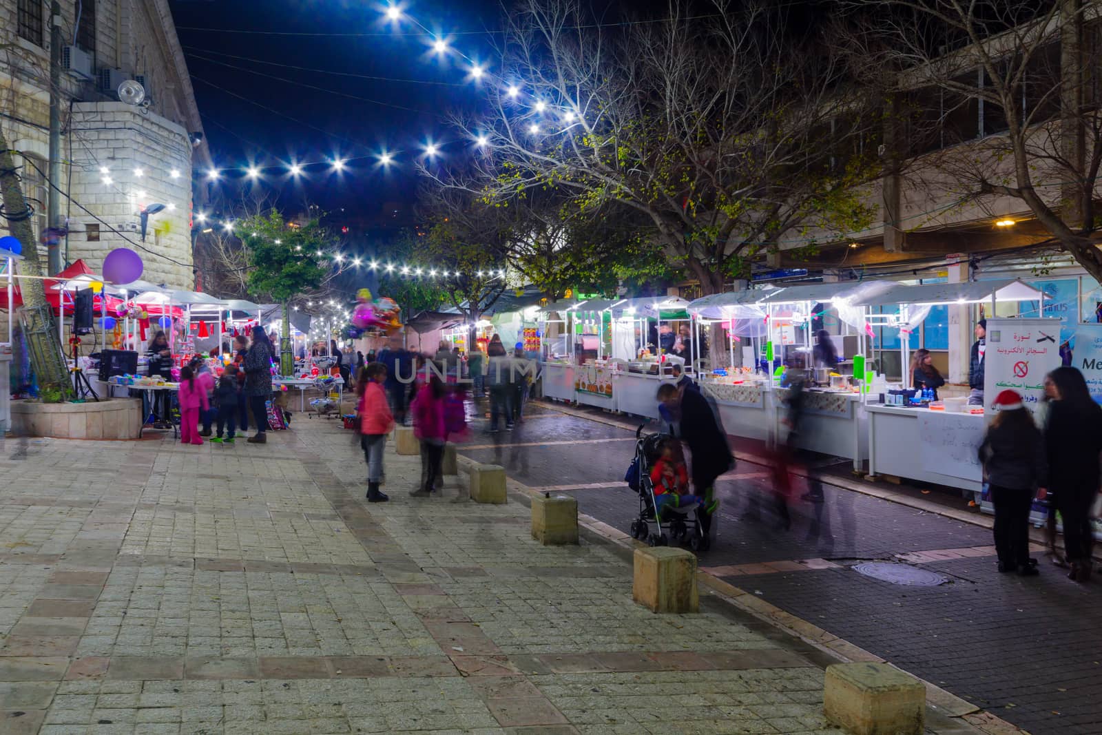 NAZARETH, ISRAEL - DECEMBER 20, 2016: Christmas market scene, with locals and tourists, in Nazareth, Israel