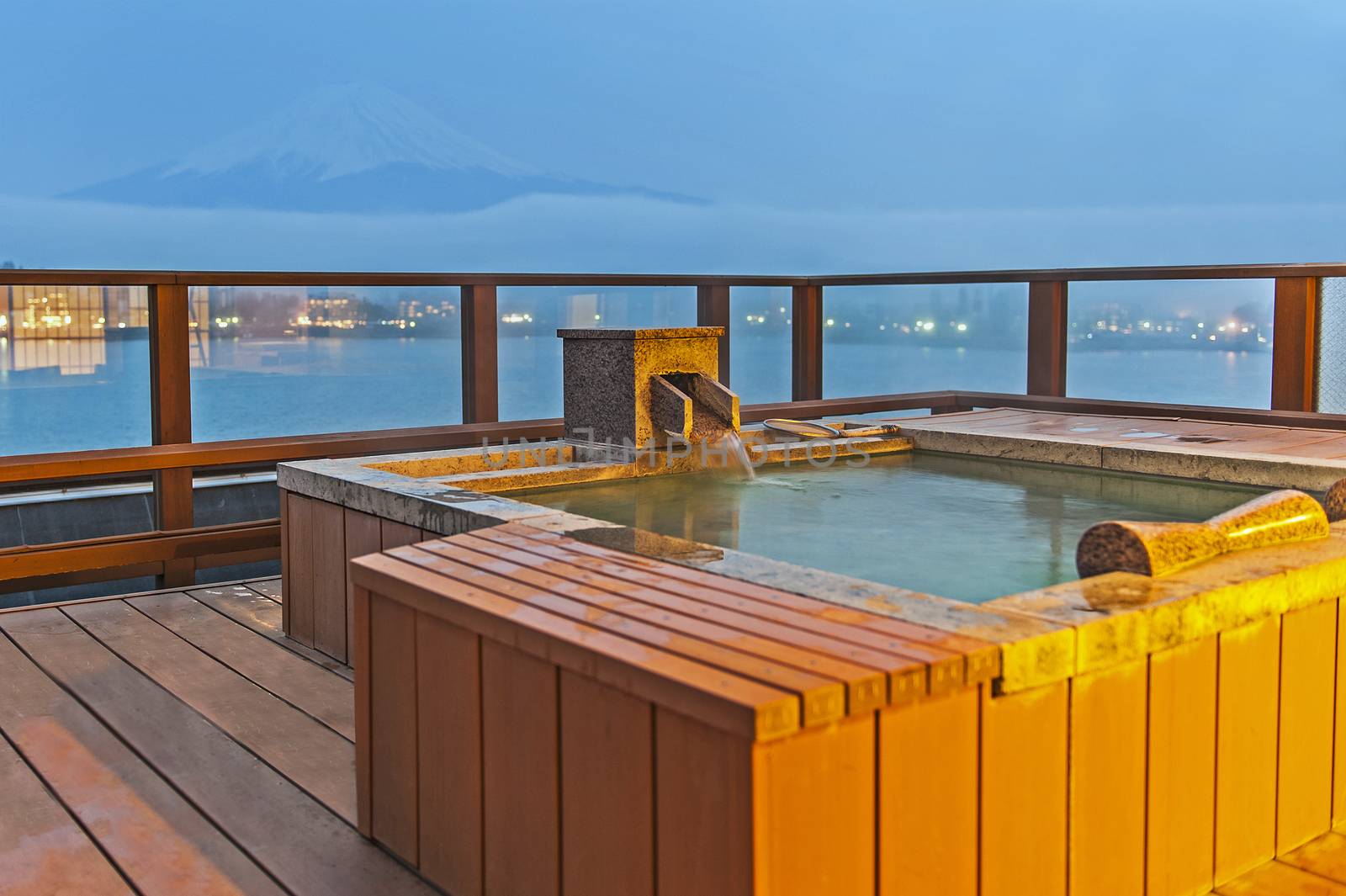 Japanese open air hot spa onsen with view of the mountain Fuji