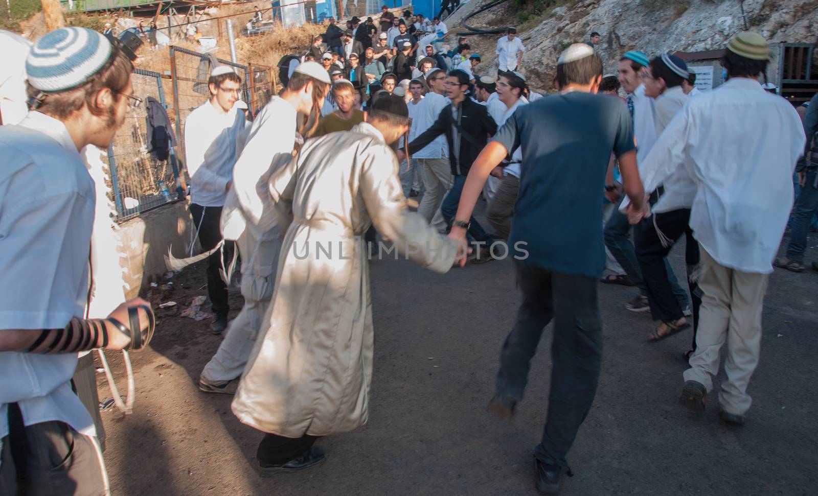 MERON, ISRAEL - MAY 18, 2014: Orthodox Jews dance at the annual hillulah of Rabbi Shimon Bar Yochai, in Meron, on Lag BaOmer Holiday. This is an annual celebration at the tomb of Rabbi Shimon