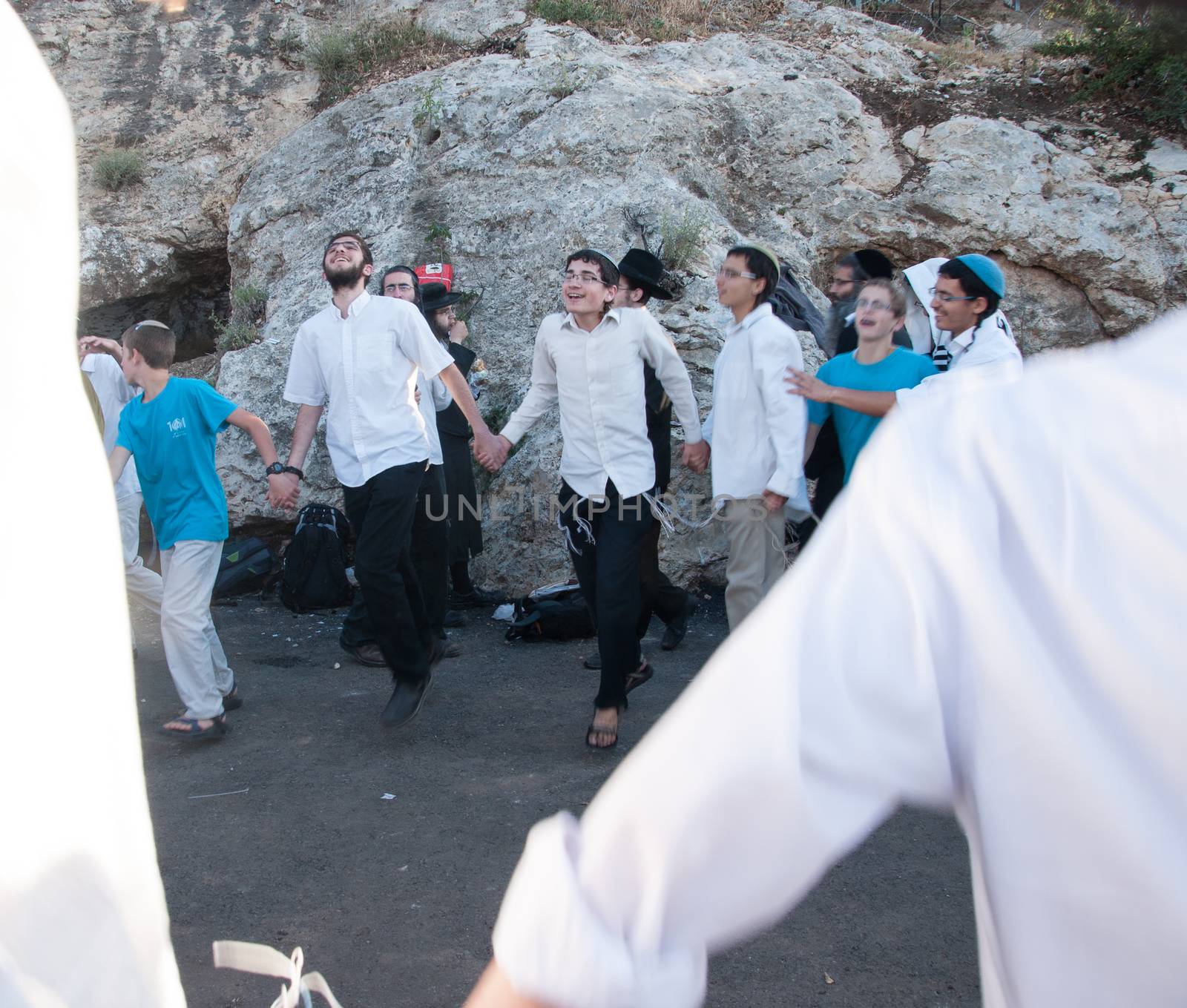 MERON, ISRAEL - MAY 18, 2014: Orthodox Jews dance at the annual hillulah of Rabbi Shimon Bar Yochai, in Meron, on Lag BaOmer Holiday. This is an annual celebration at the tomb of Rabbi Shimon