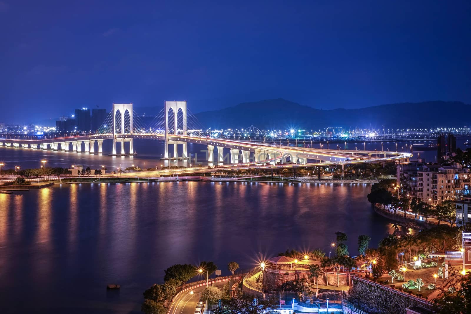Bridge in Macau view at night by Surasak