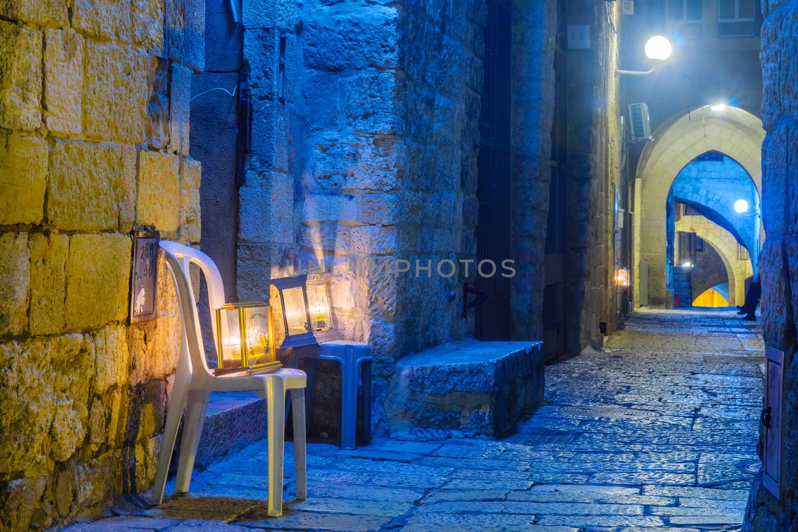 JERUSALEM, ISRAEL - DECEMBER 29, 2016: Alley with a display of Traditional Menorahs (Hanukkah Lamps) with olive oil candles, in the Jewish quarter, Jerusalem Old City, Israel