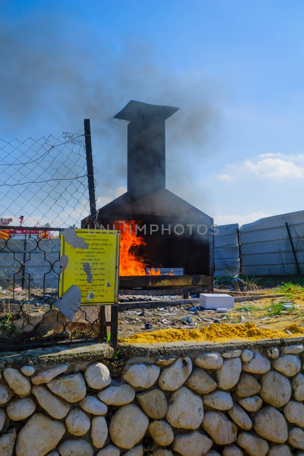 NETIVOT, ISRAEL - JAN 30, 2017: A furnace for traditional tossing of candles at the Rabbi Israel Abuhatzeira (Baba Sali) tomb, Netivot, Israel