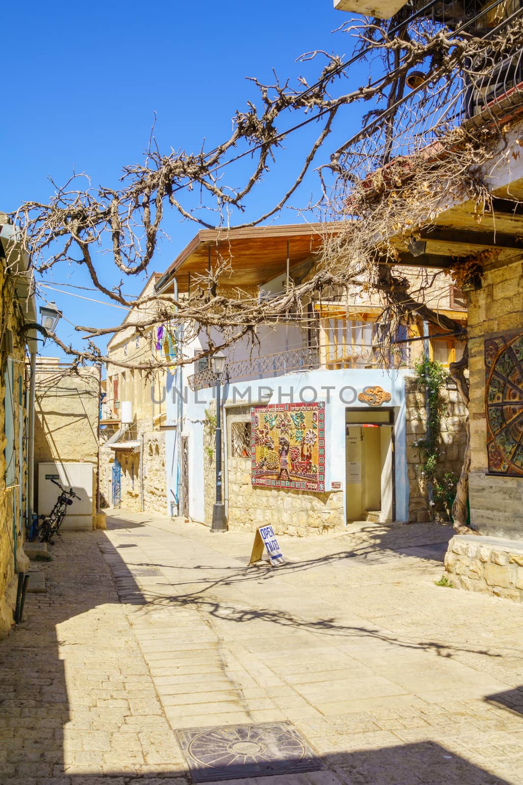 SAFED, ISRAEL - SEPTEMBER 18, 2015: An alley in the artist quarter, with local galleries and other businesses, in Safed, Israel