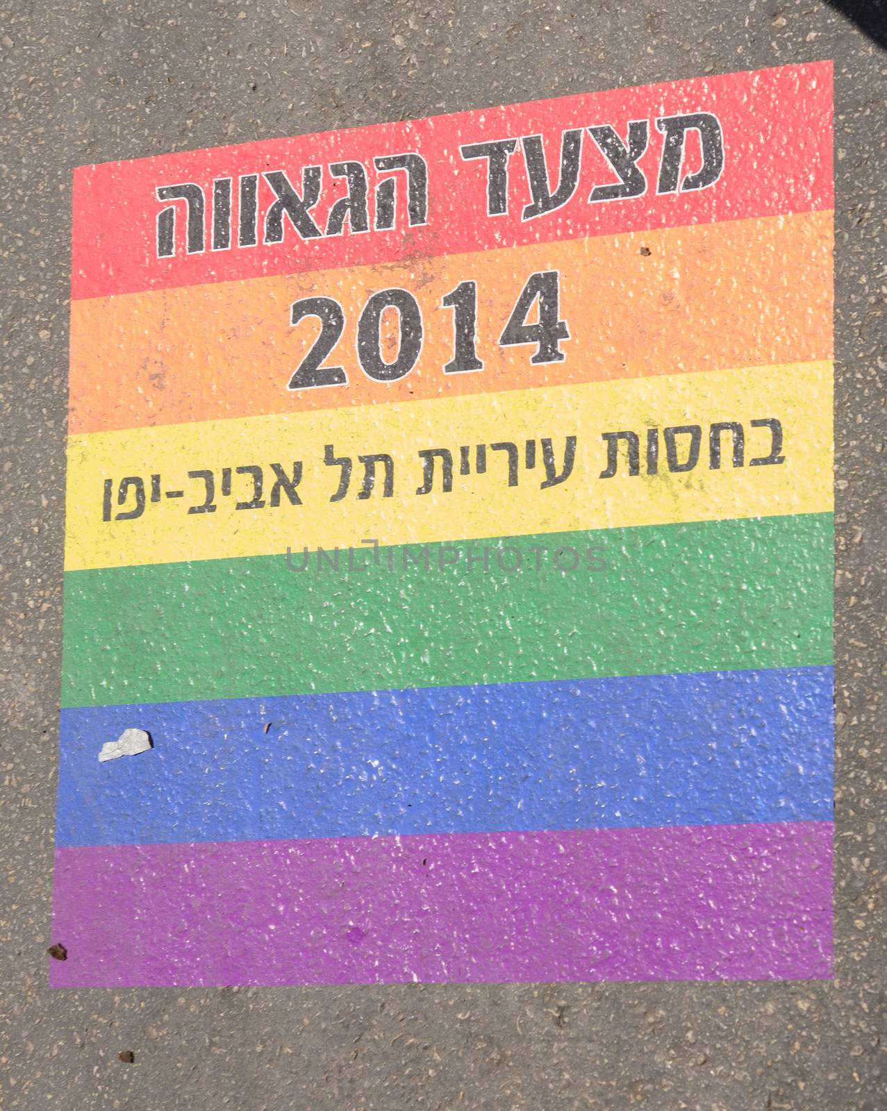 TEL-AVIV - JUNE 13, 2014: A printed sign on the street floor - Pride Parade 2014 Sponsored by the city of Tel Aviv. The pride Parade is an annual event of the gay community