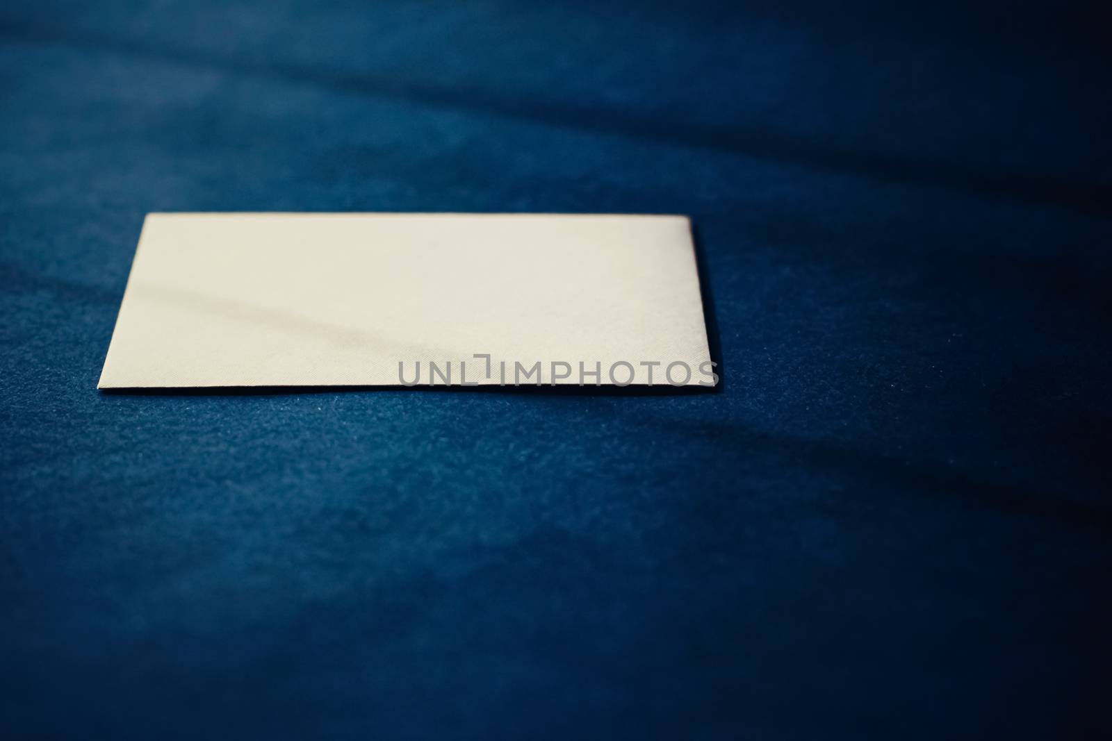 Blank beige paper card on blue background, business and luxury brand identity mockup by Anneleven