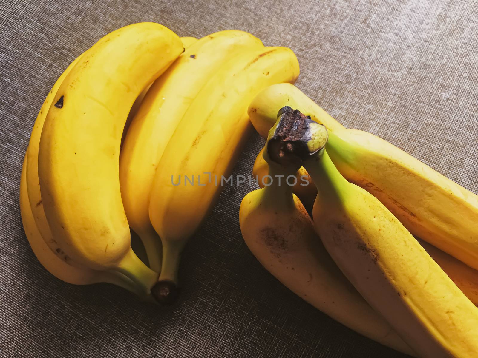 Organic bananas on rustic linen background, fruits farming and agriculture