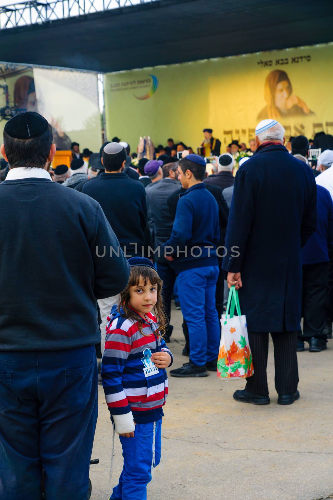 NETIVOT, ISRAEL - JANUARY 30, 2017: Jewish men attend a ceremony near the Rabbi Israel Abuhatzeira (Baba Sali) tomb, as part of the annual hillula of his memory. In Netivot, Israel