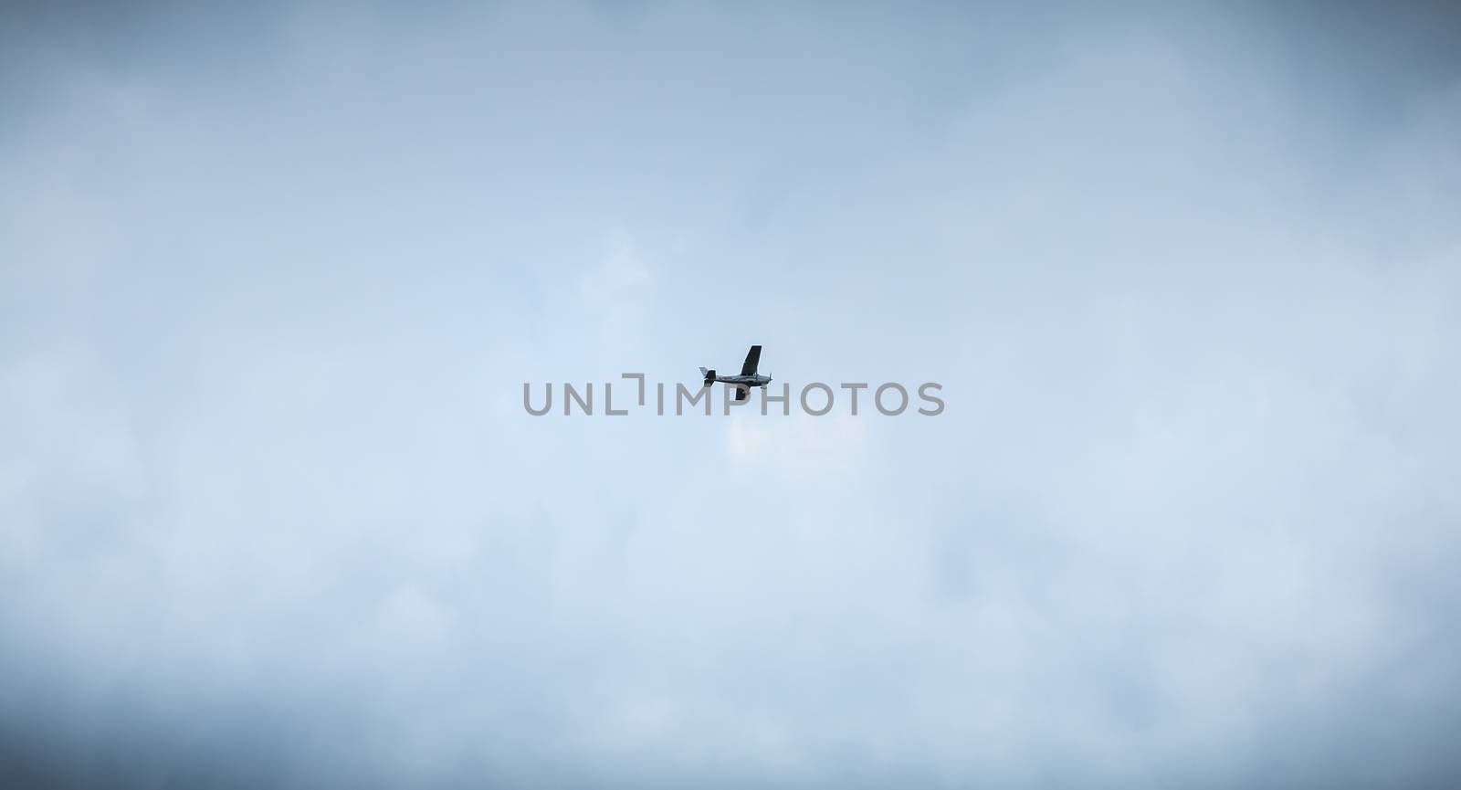 Port Joinville, France - September 16, 2018: Small passenger plane flying over Isle of Yeu near France on a fall day