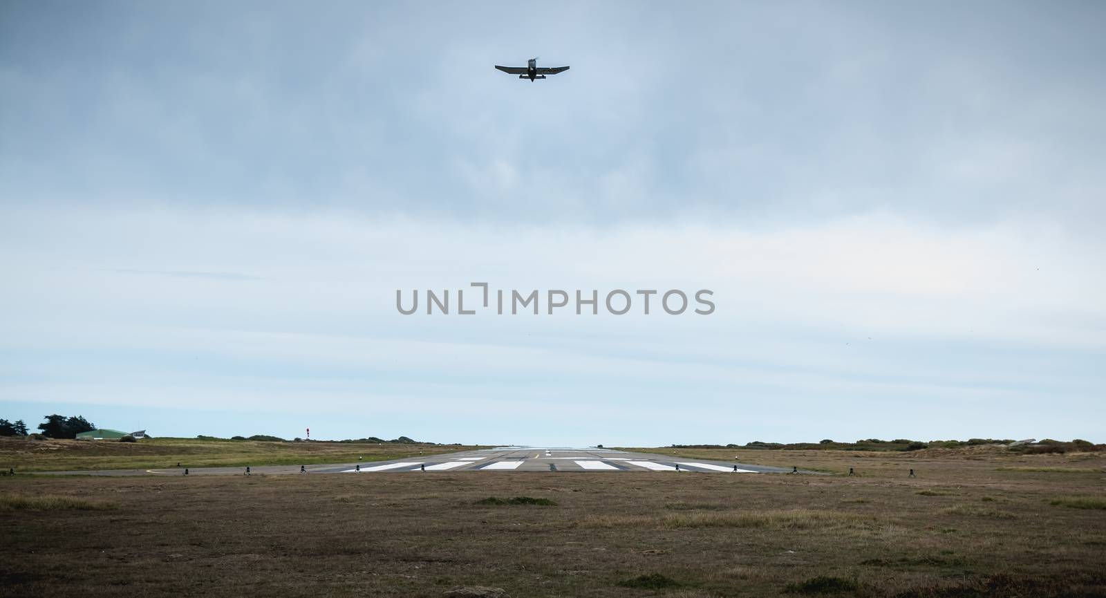 Small passenger plane taking off from an airfield on Yeu Island  by AtlanticEUROSTOXX