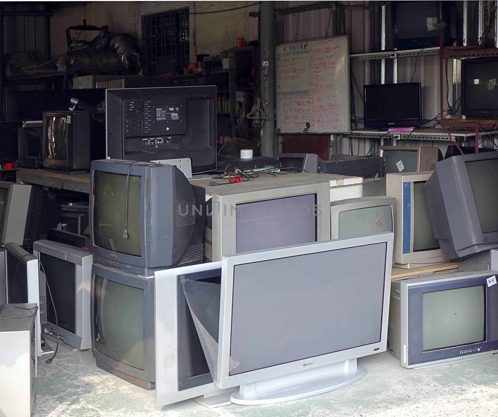 KAOHSIUNG, TAIWAN -- OCTOBER 17, 2015: A local store for the repair and recycling of traditional and flat screen televisions.