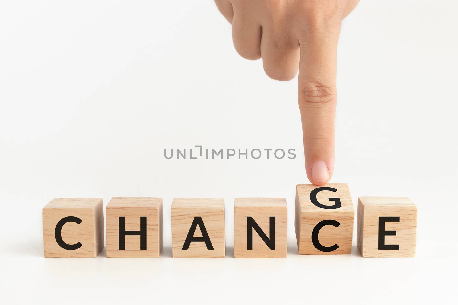 hand flip wooden cube with word change to chance. self improvement, personal development for skills and qualities and career growth or change yourself concept by asiandelight