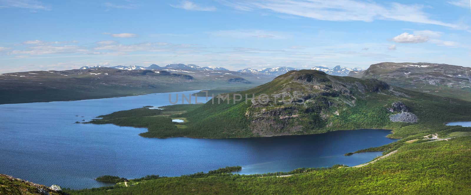 Panoramic view of Lake Kilpisjarvi and Malla fells, seen from Saanatunturi fell to North. Snowy mountain tops are in Sweden and Norway.