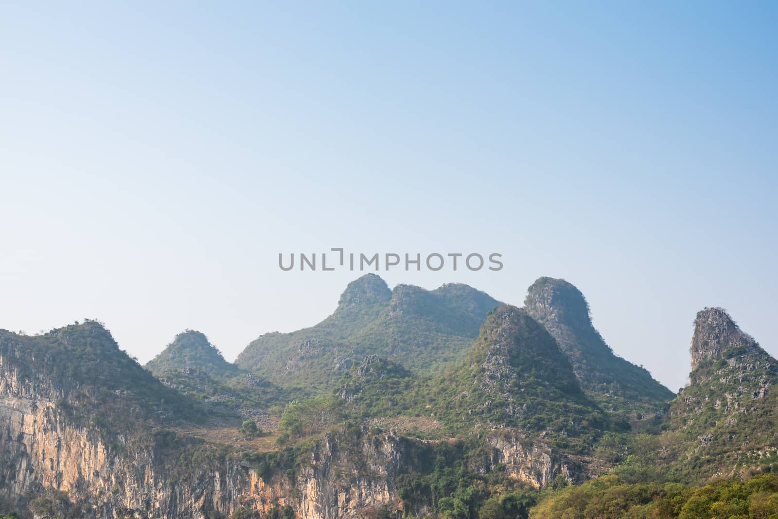 Karst formation and foggy limestone mountain landscape between Guiling and Yangshuo, Guangxi province, China