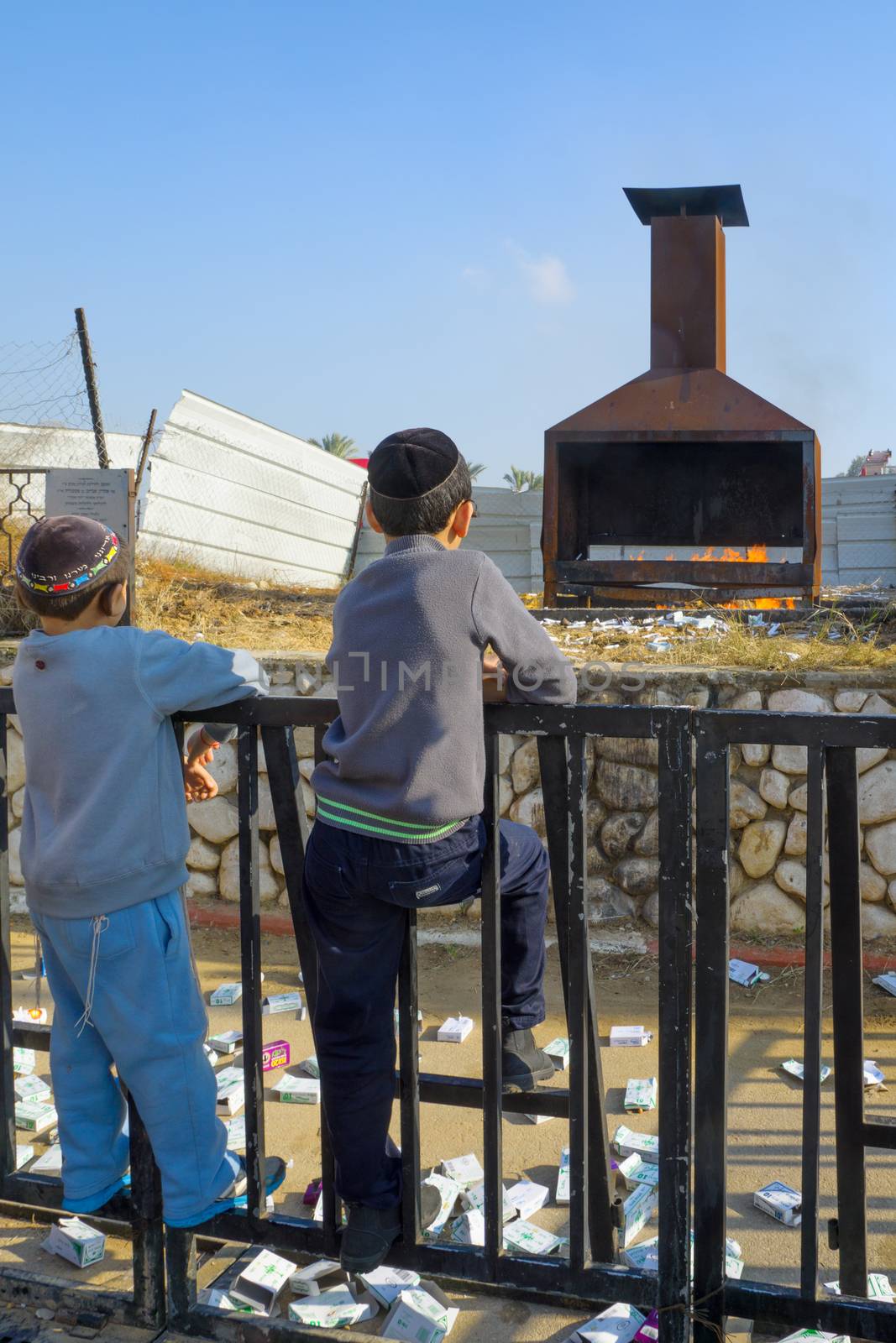 NETIVOT, ISRAEL - JAN 13, 2016: Jewish kids looks at a furnace at the Rabbi Israel Abuhaseira (Baba Sali) tomb, as part of the annual hillula of his memory. Netivot, Israel