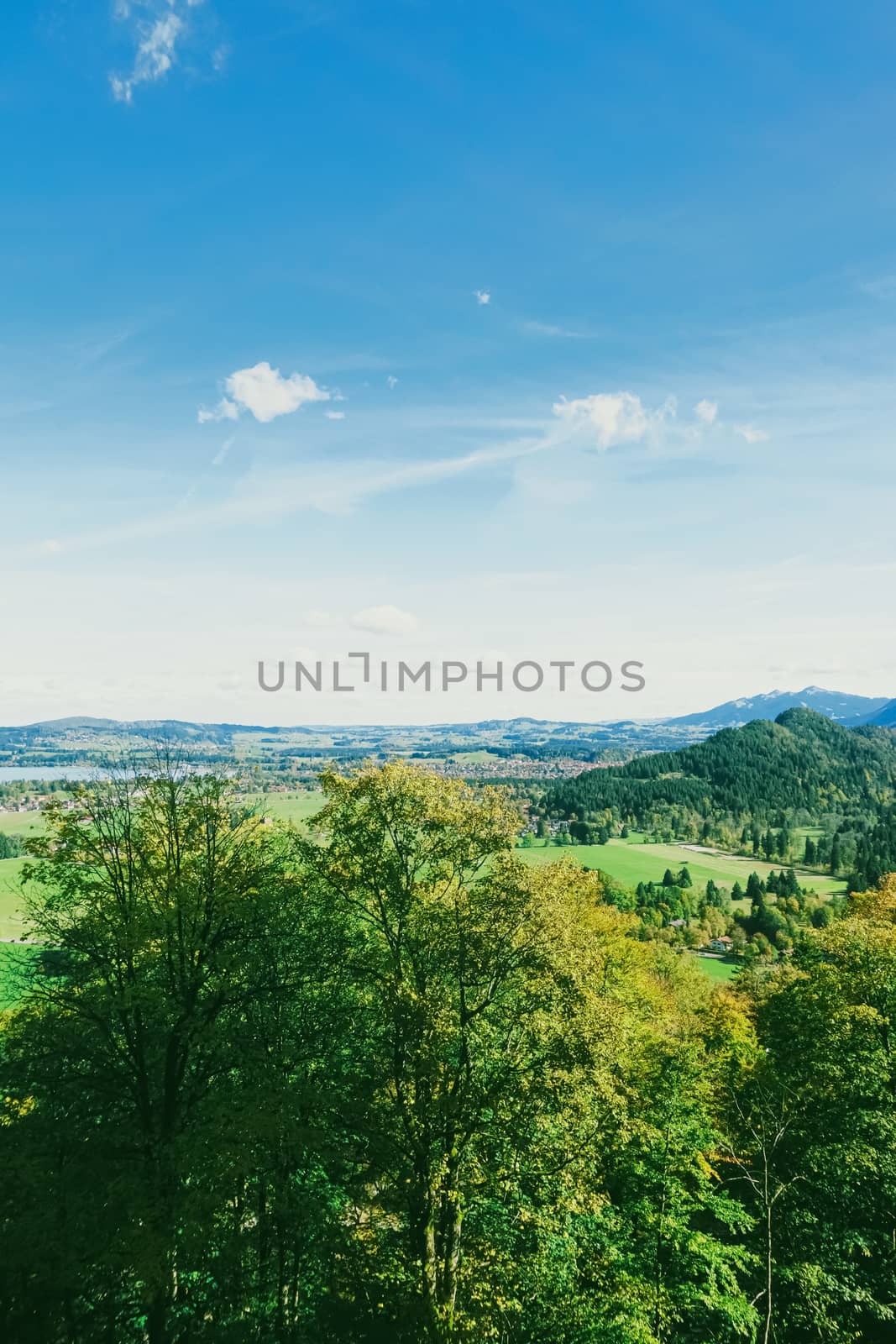 Beautiful nature of European Alps, landscape view of alpine mountains, lake and village in spring season, travel and destination scenery