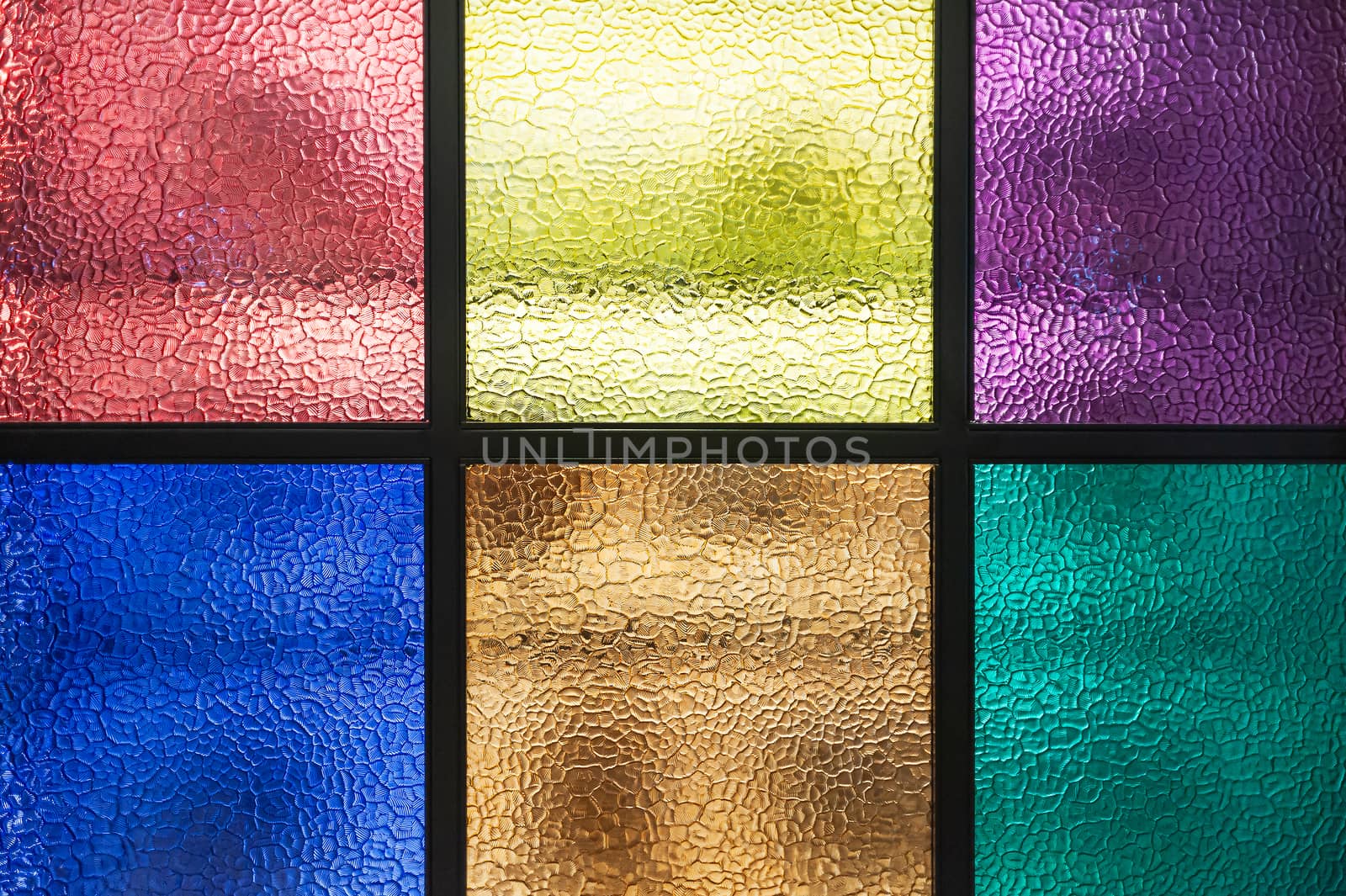 Decorative window of various colored rectangles with light coming through