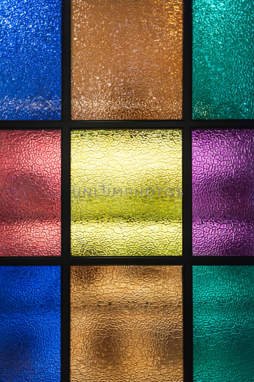 Decorative window of various colored rectangles with light coming through