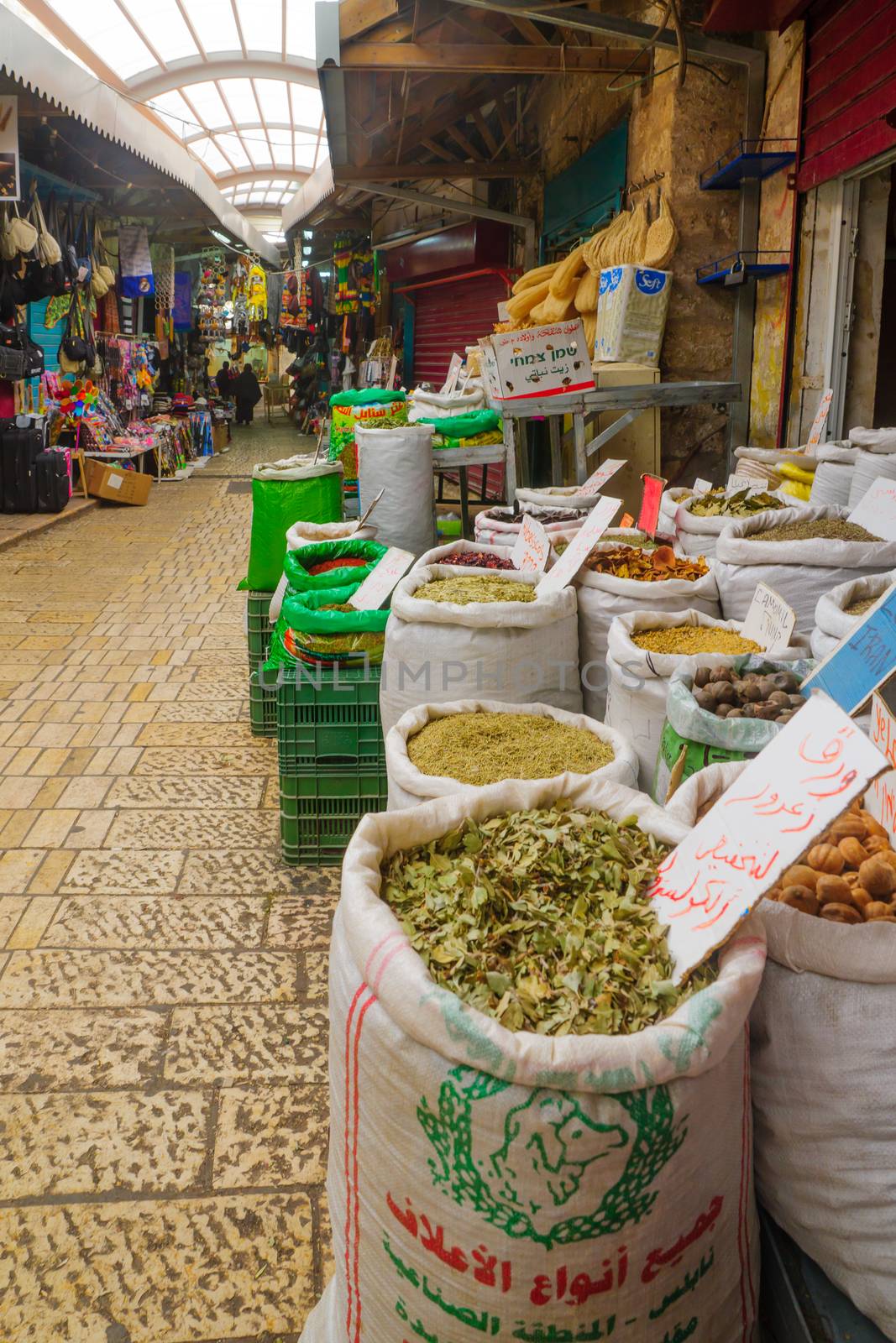 ACRE, ISRAEL - JANUARY 18, 2016: Market scene in the old city, with sellers and shoppers, in Acre, Israel