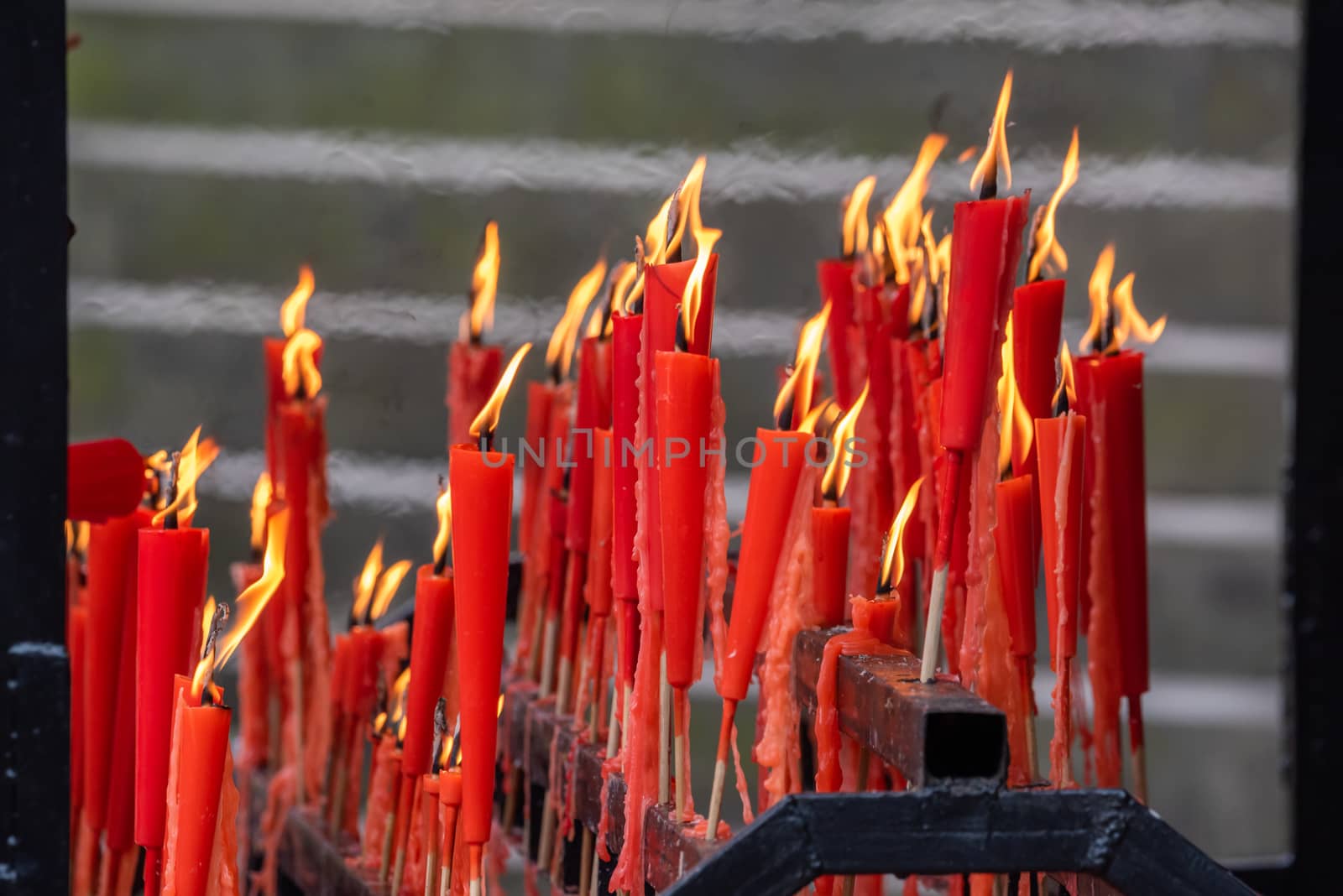 Red candles burning in a taoist temple in QingChengShan, Sichuan Province, China