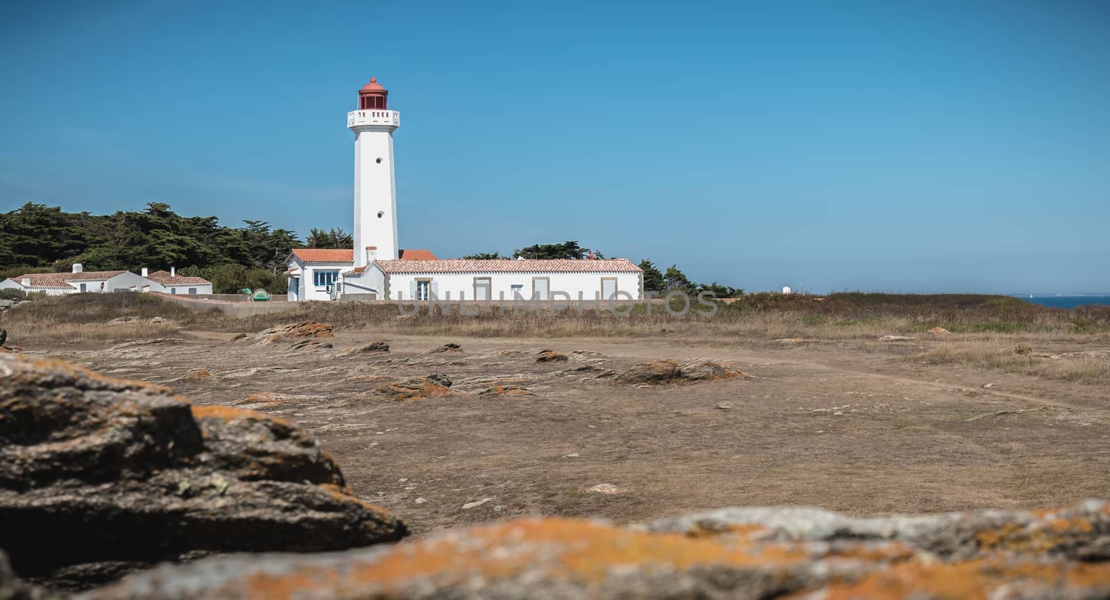 Port Joinville, France - September 17, 2018 - Architectural detail of the Corbeaux Marine Lighthouse on a summer day