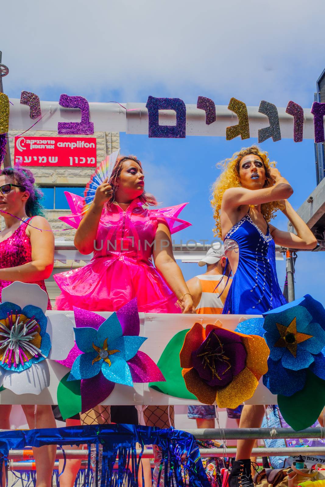 HAIFA, Israel - June 30, 2017: Dancers on a truck entertain the crowd during the annual pride parade of the LGBT community, in the streets of Haifa, Israel
