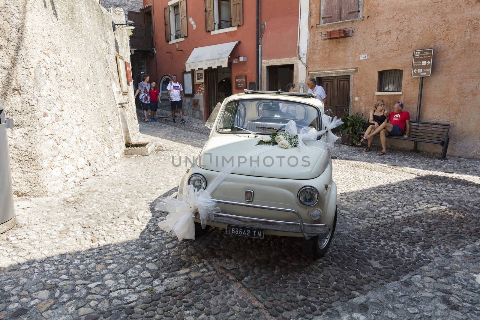 Malcesine, Lake Garda, Italy, August 2019, some wedding flowers on a Fiat 500 bonnet