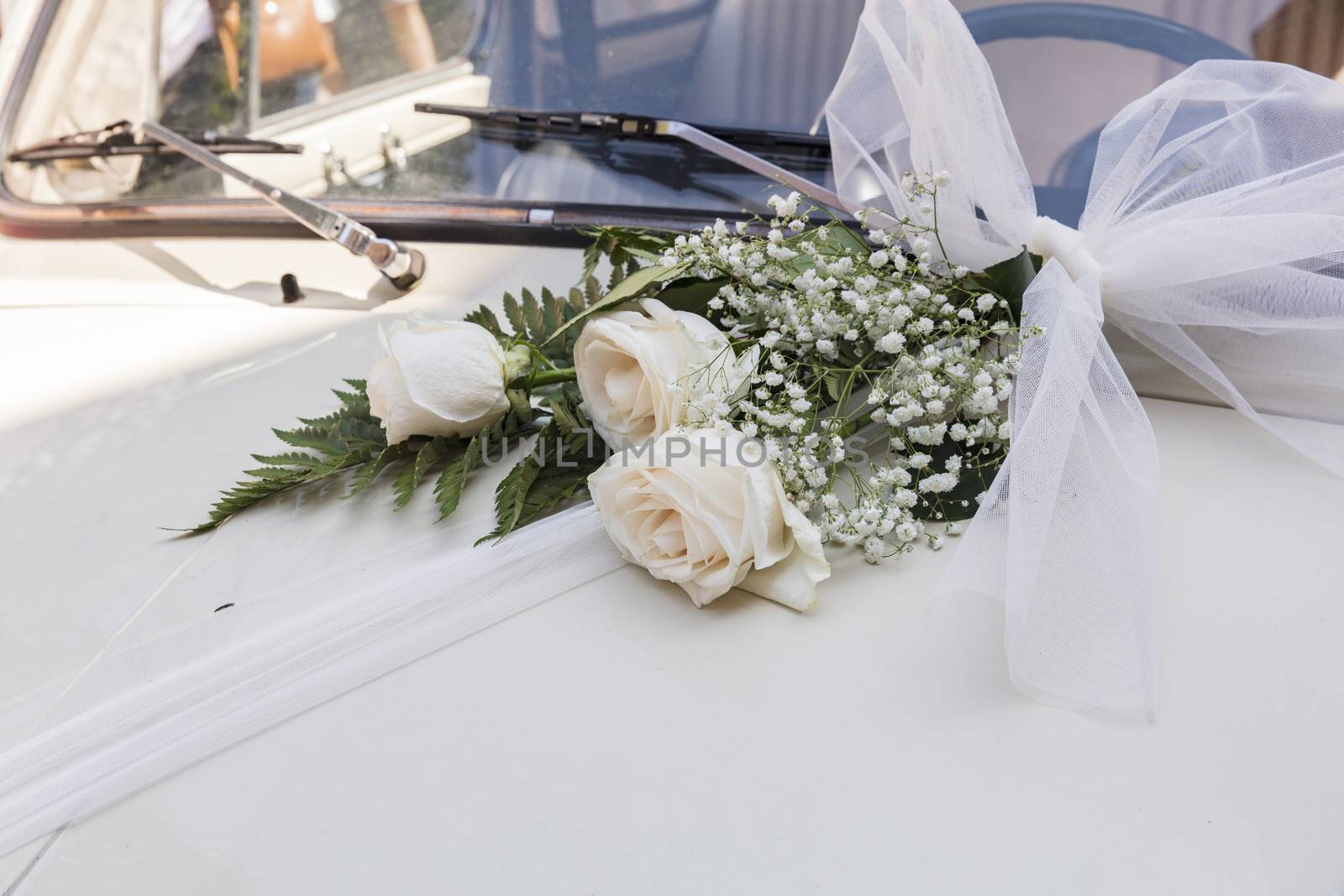 Malcesine, Lake Garda, Italy, August 2019, some wedding flowers on a Fiat 500 bonnet