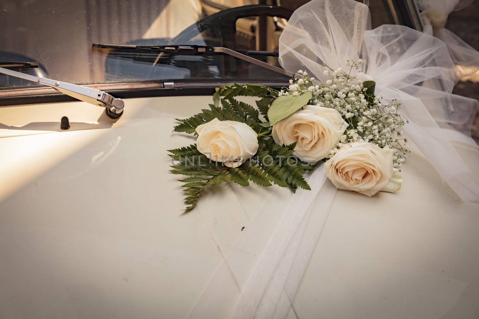 Malcesine, Lake Garda, Italy, August 2019, some wedding flowers on a Fiat 500 bonnet