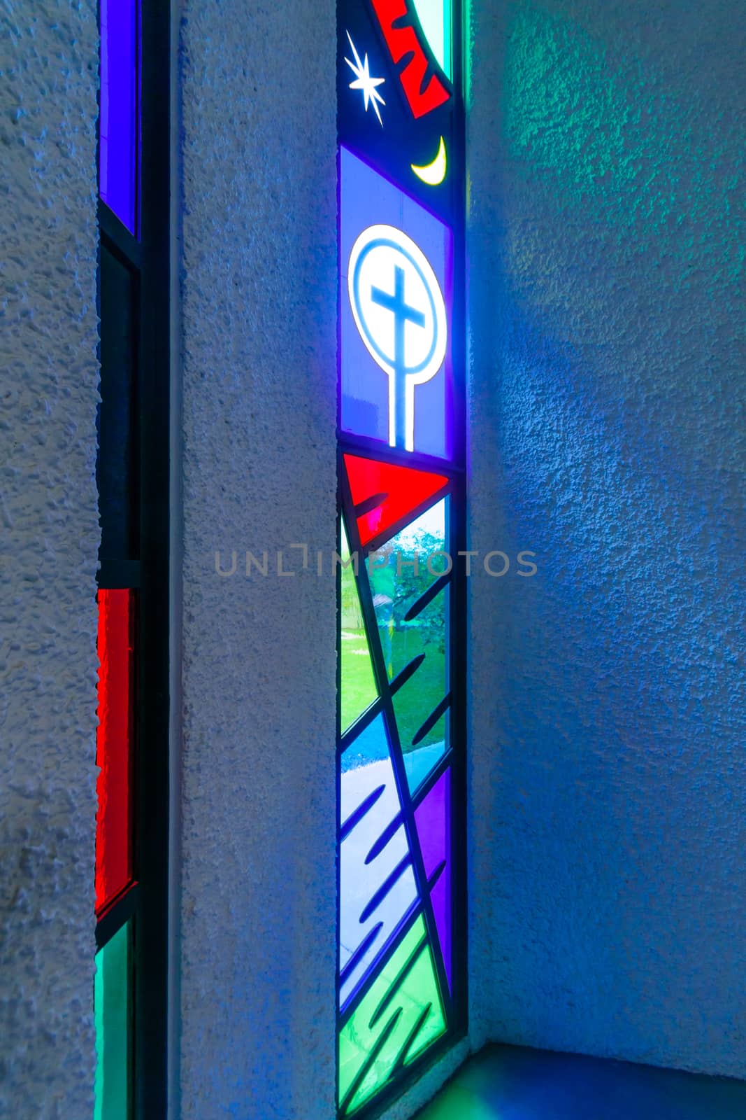 KORAZIM, ISRAEL - JANUARY 22, 2016: A colorful stained glass window at the Domus Galilaeae (House of Galilee) Monastery, on the peak of Mount of Beatitudes, Israel