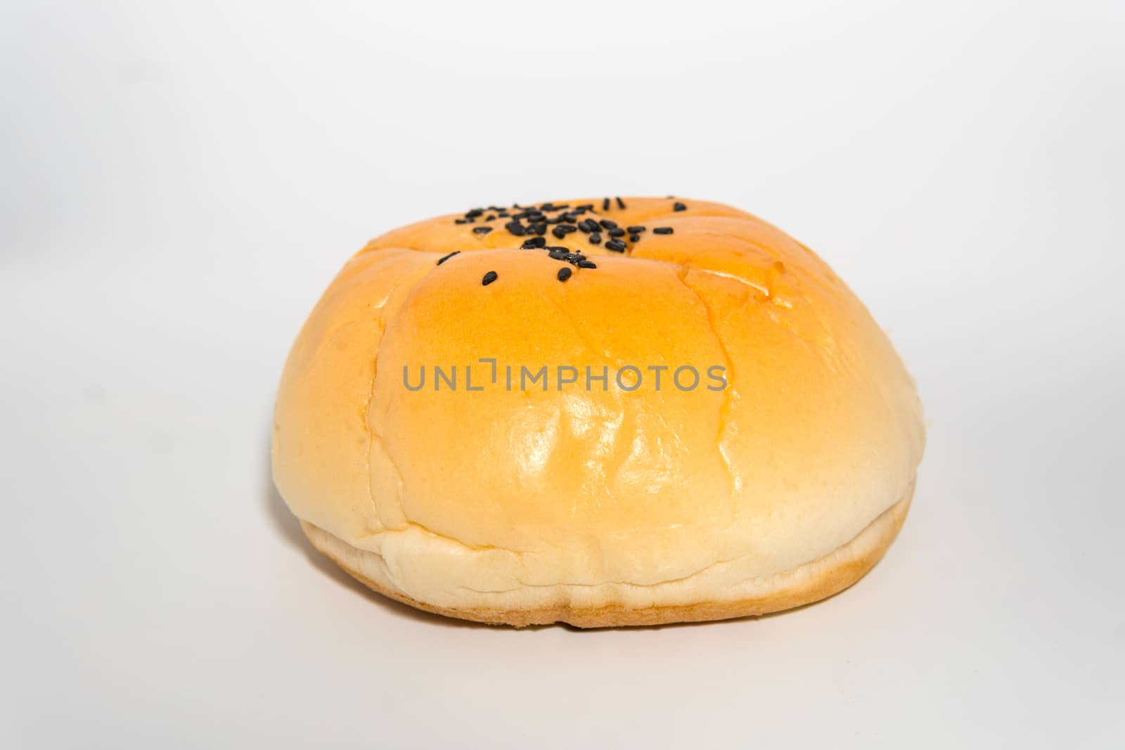 homemade buns with black sesame on top on white background