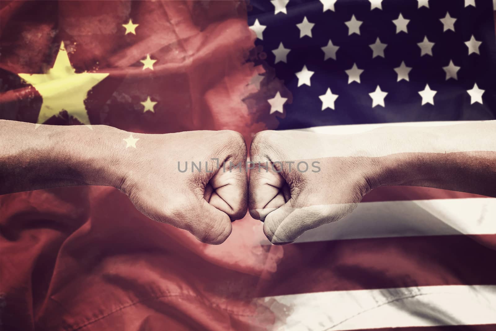 trade war between USA and China concept. two clenched fists punch each other on USA and China flag background