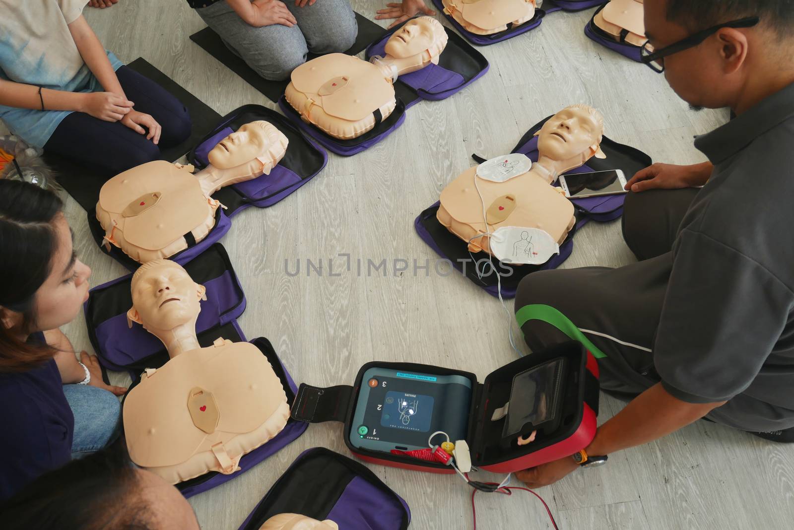 BANGKOK, THAILAND - OCTOBER 6, 2019 : a part of trainee , participant of CPR First Aid Training course using hand pump on chest of dummy for primary safe life in Bangkok, Thailand on October 6, 2019