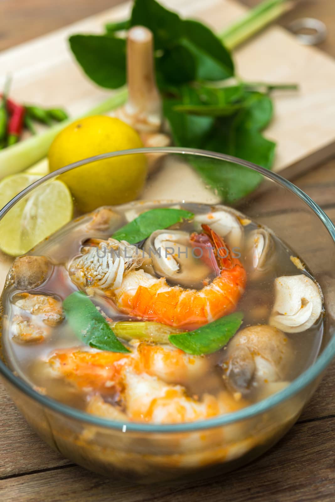 Hot and sour seafood soup (Tom Yum) for sale at Thai street food market or restaurant in Thailand