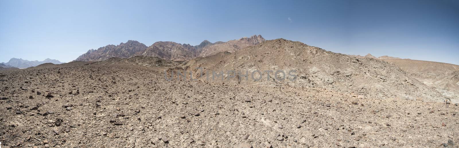 Panorama of rocky mountain slope landscape in an arid desert environment