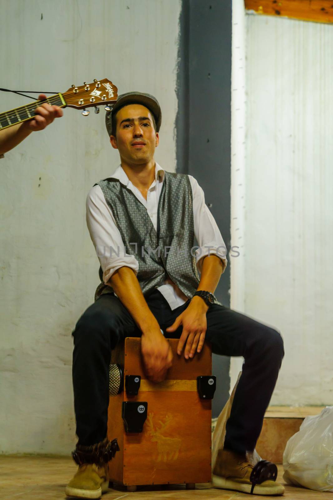 SAFED, ISRAEL - AUGUST 23, 2017: Scene of the Klezmer Festival, with street musician playing, in Safed (Tzfat), Israel. Its the 30th annual traditional Jewish festival in the public streets of Safed