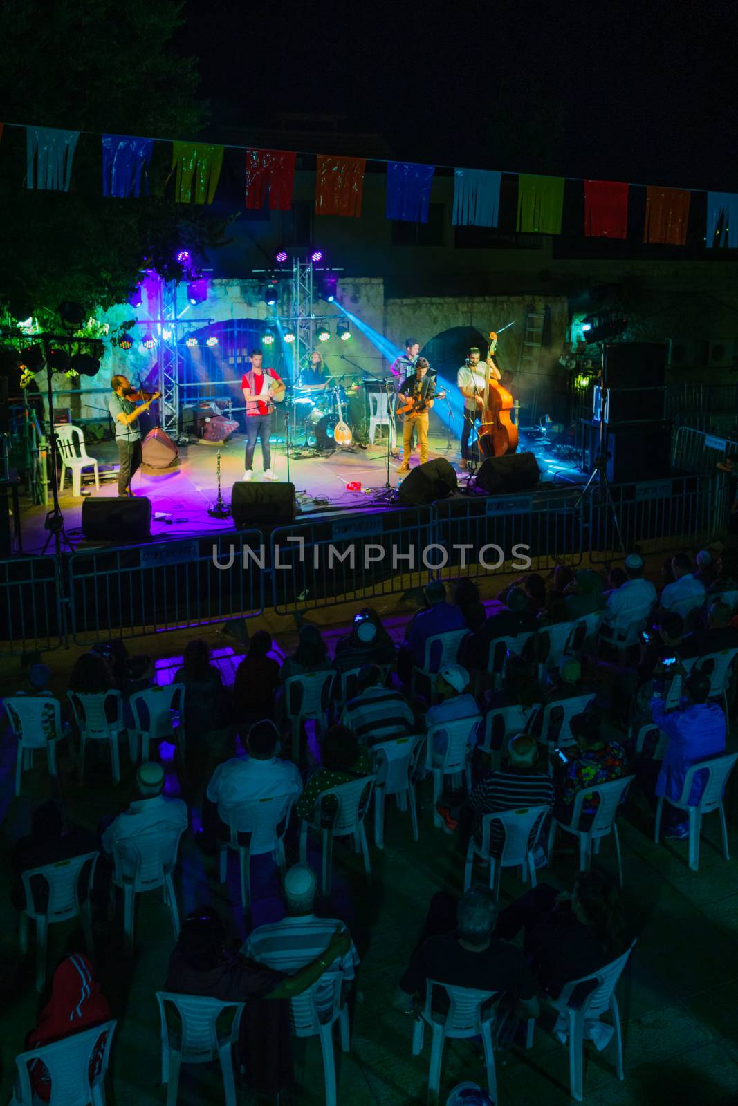 SAFED, ISRAEL - AUG 23, 2017: Group of musicians (Gute Gute) and crowd at the Klezmer Festival in Safed (Tzfat), Israel. Its the 30th annual traditional Jewish festival in the public streets of Safed