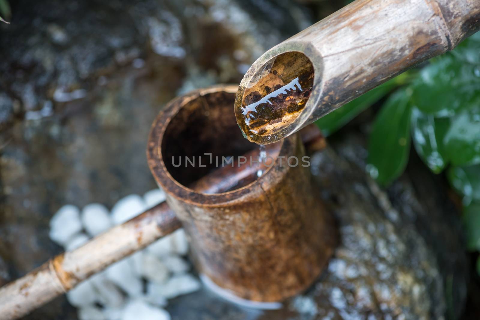 Natural wooden gutter tree fountain close-up view in Chengdu, Sichuan province, China