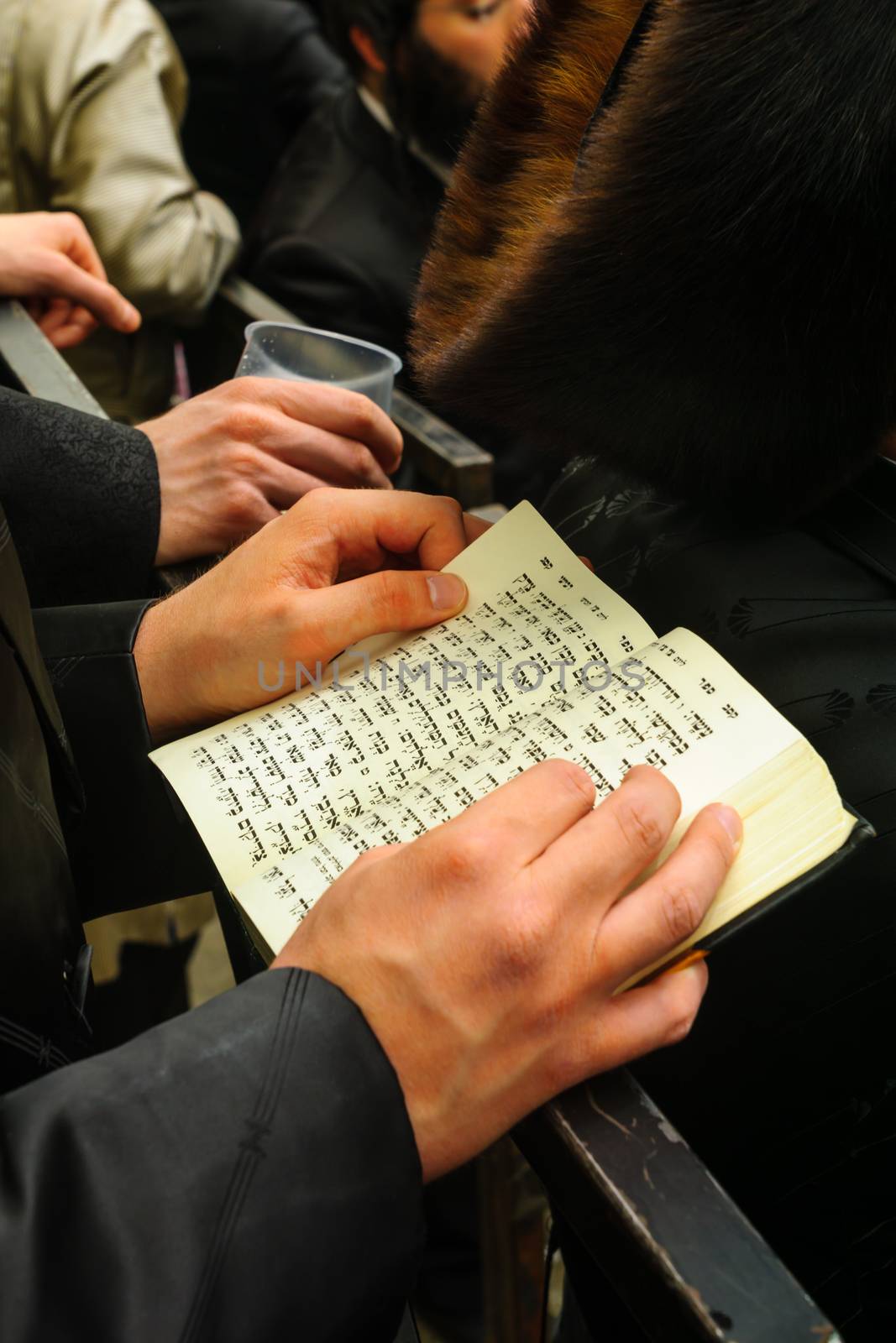 JERUSALEM, ISRAEL - MARCH 25, 2016: Jewish man read a holy book, part of a celebration of the Jewish Holyday Purim, in the ultra-orthodox neighborhood Mea Shearim, Jerusalem, Israel