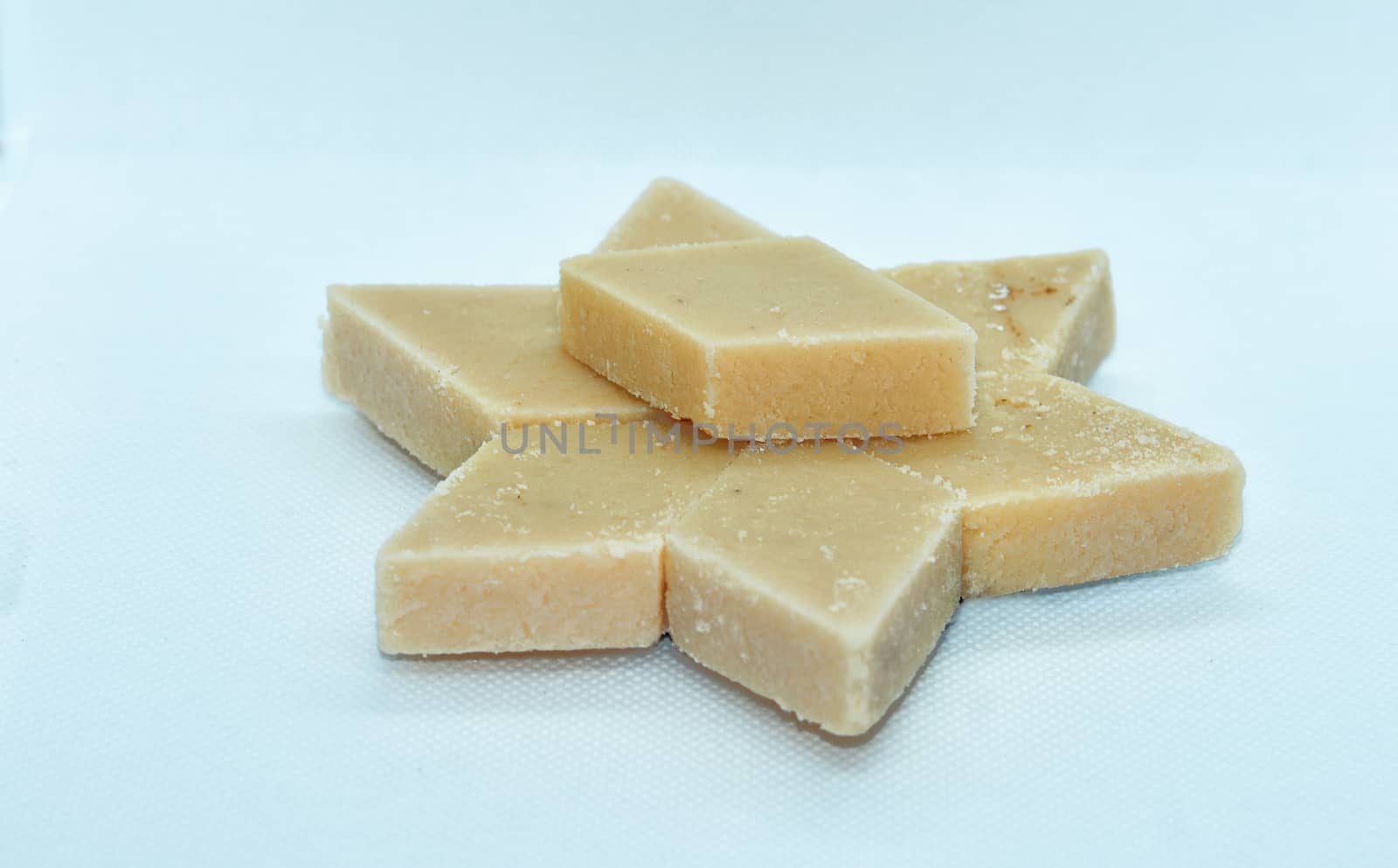cashew barfi Cut in diamond shapes, the rich texture of these desserts render a sweet and nutty feel to the mouths.