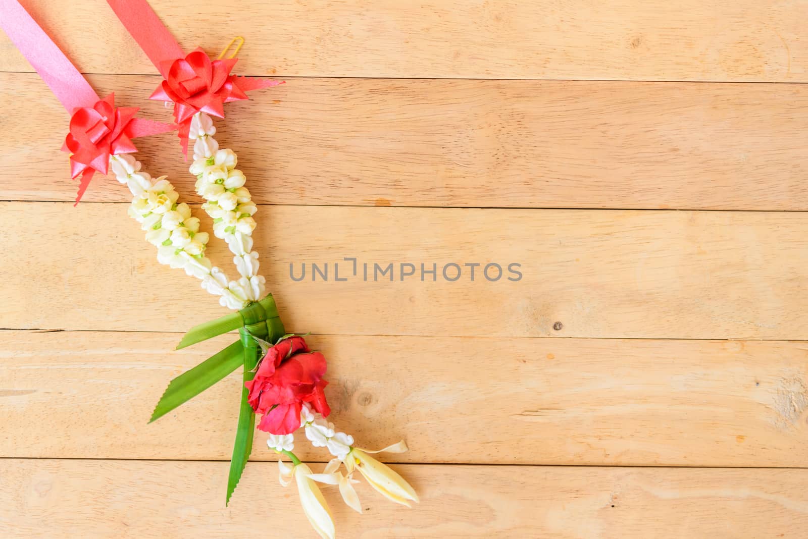 Garland to pay respect of Thai culture on wood plate