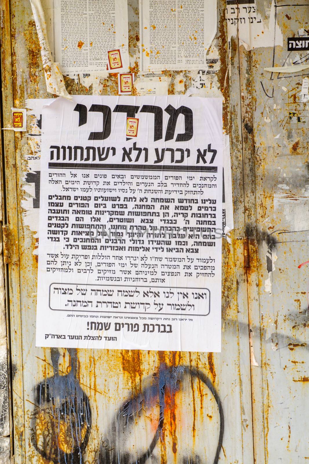 JERUSALEM, ISRAEL - MARCH 25, 2016: Pashkevil posters, of the orthodox Jewish community, about the Purim Holyday, in the ultra-orthodox neighborhood Mea Shearim, Jerusalem, Israel