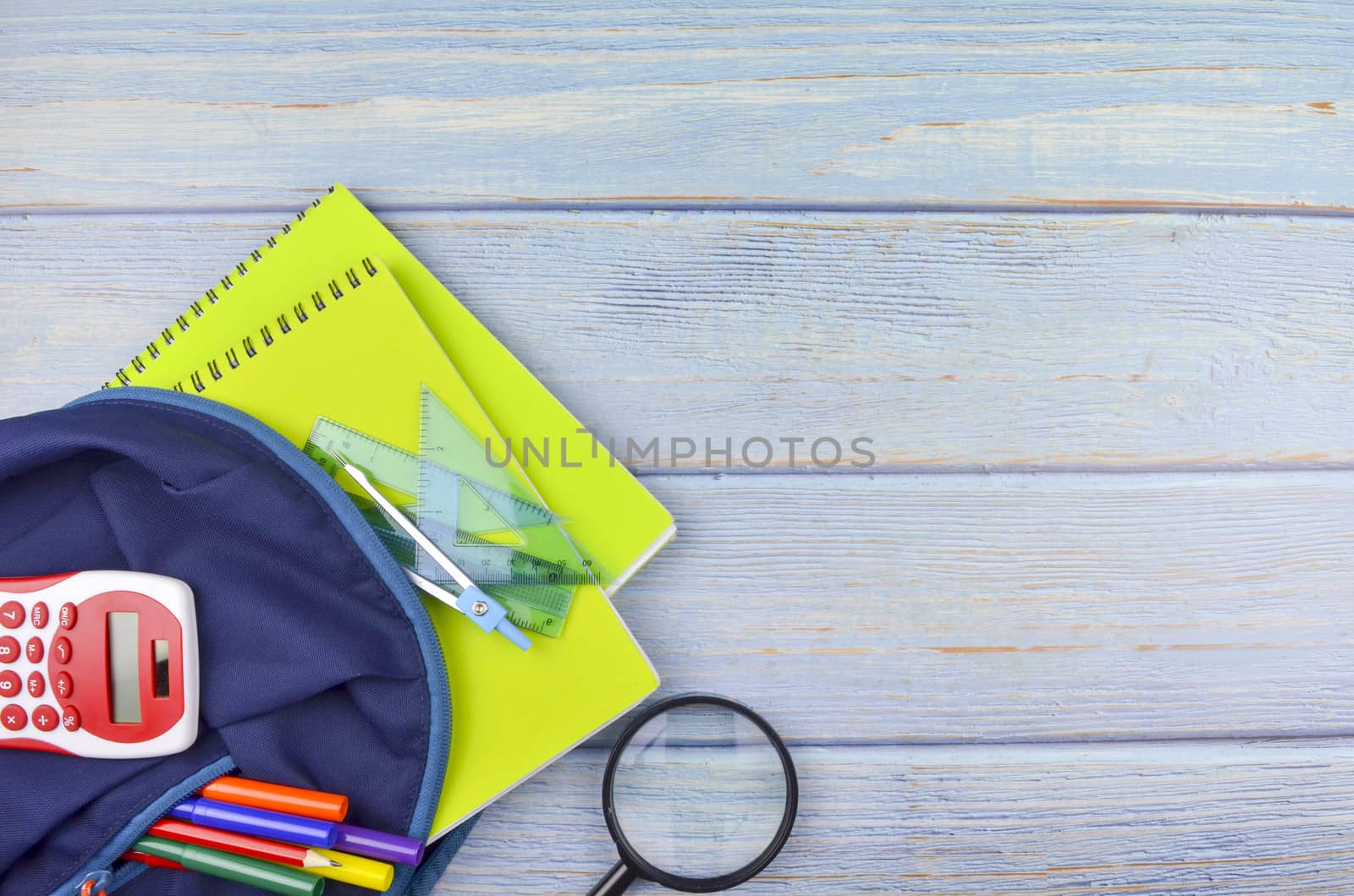 Student backpack and various school supplies, studing, education and back to school concept.