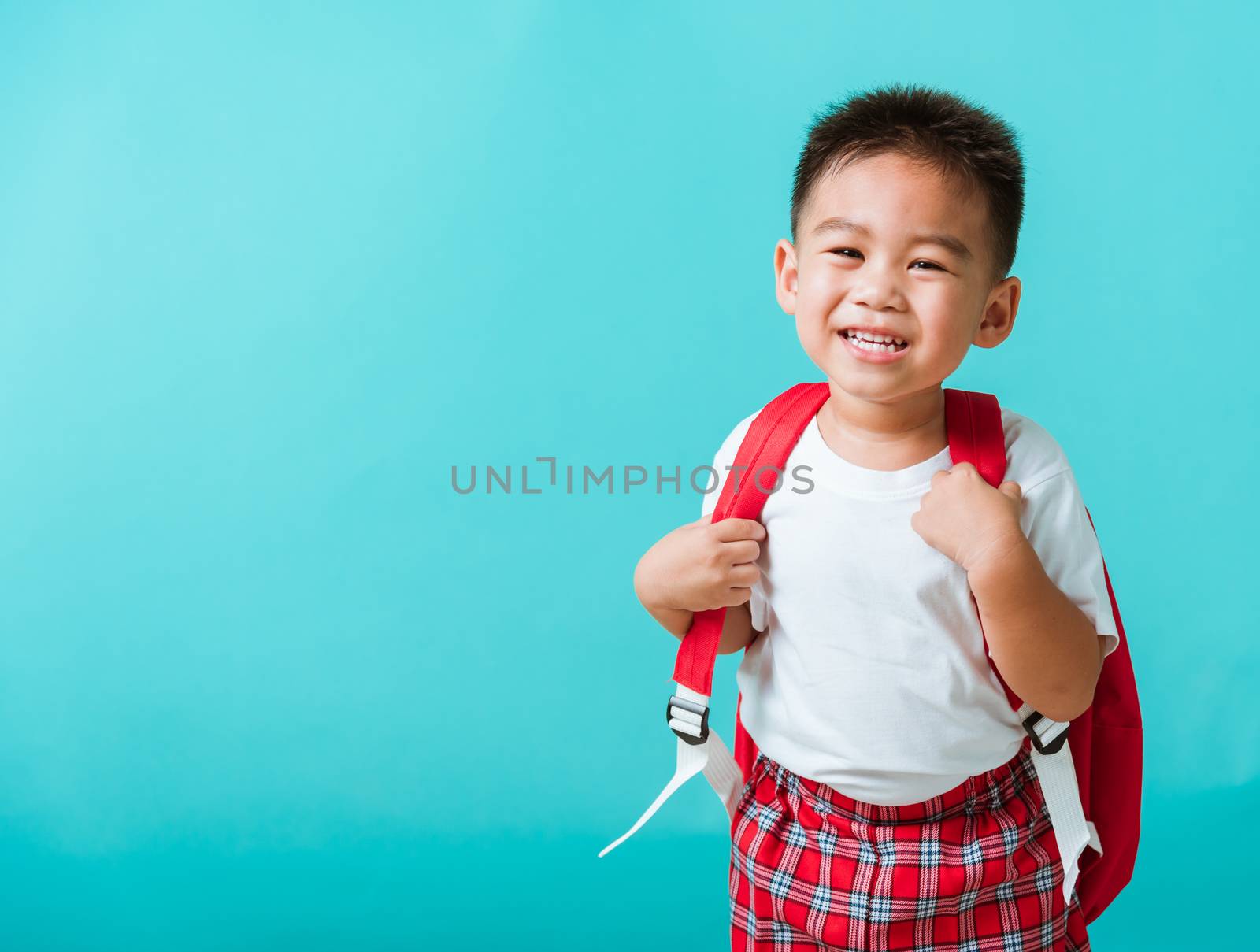 Portrait closeup happy Asian cute little child boy in uniform sm by Sorapop