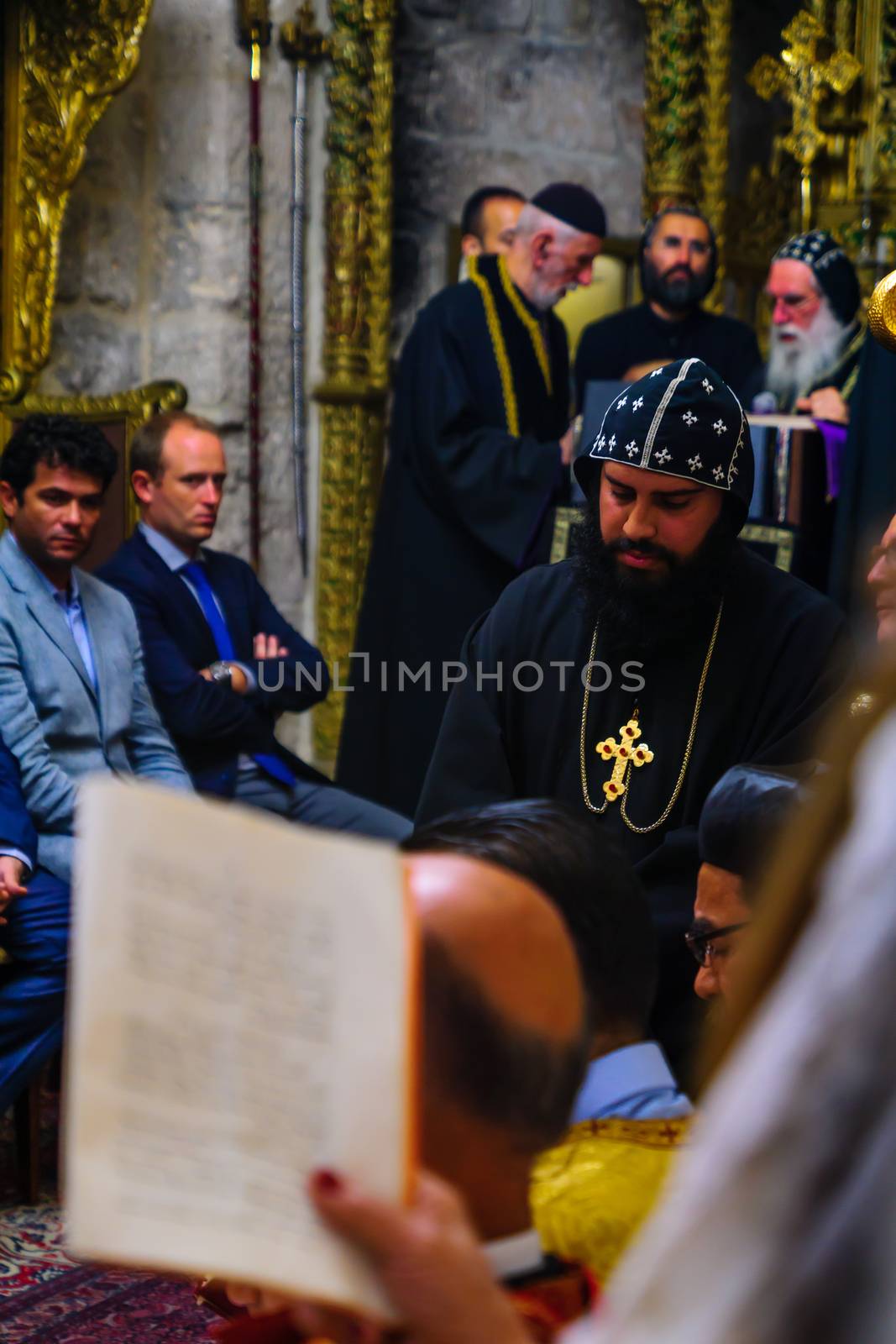 JERUSALEM, ISRAEL - APR 28, 2016: Washing of the Feet ceremony, in the Syrian Orthodox St. Marks church, with the patriarch and community members. Orthodox Holy Thursday in the old city of Jerusalem, Israel