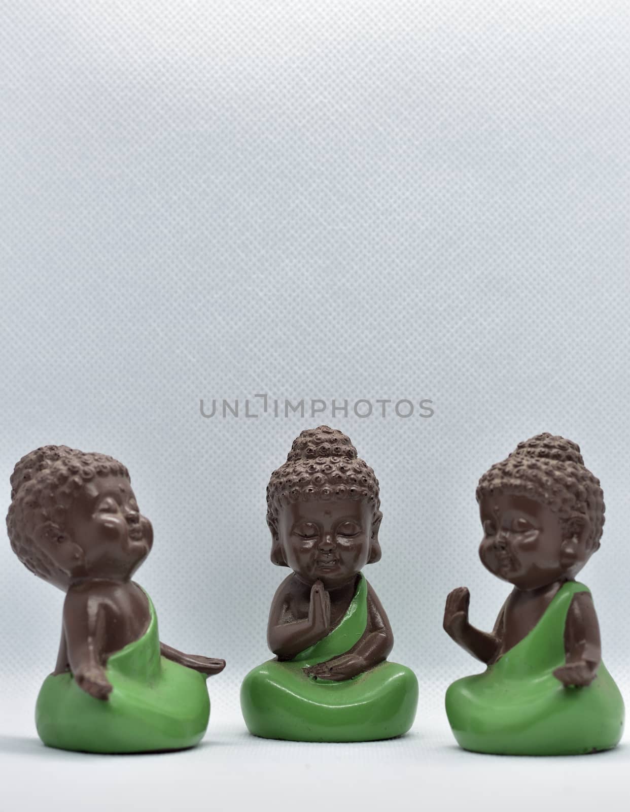 Three cute monk figures attract attention and also meaningful with modern simplicity.
