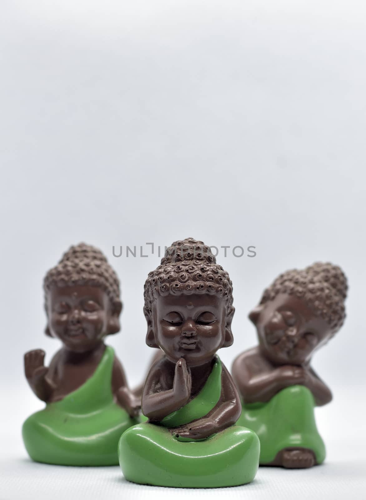 One monk and two more cute monk figures attract attention and also meaningful with modern simplicity
